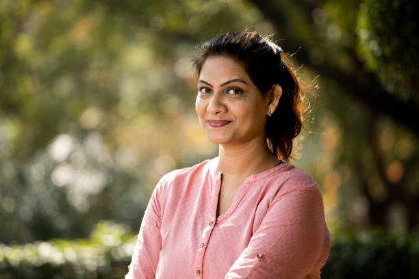 istock Portrait woman at park 1205344491