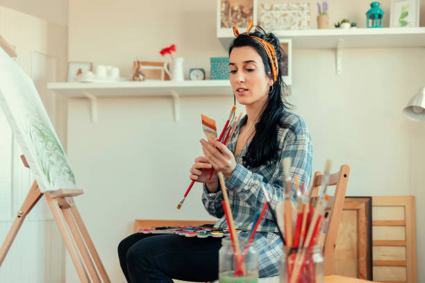 istock Female Painting on Canvas 1205347510