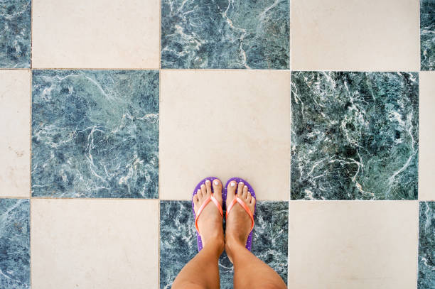 istock Legs on the colored tiles 1205348727