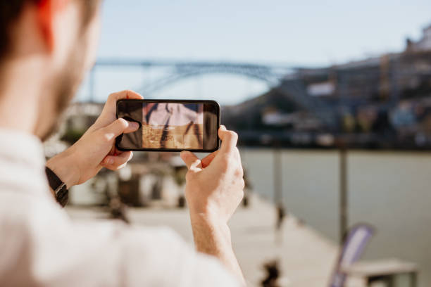 istock Man taking a picture with a smartphone 1205349125