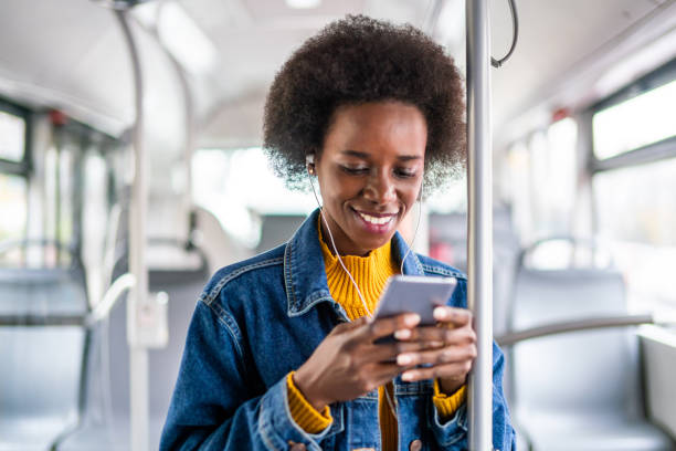 istock Young woman traveling by bus and using smart phone. 1205353547