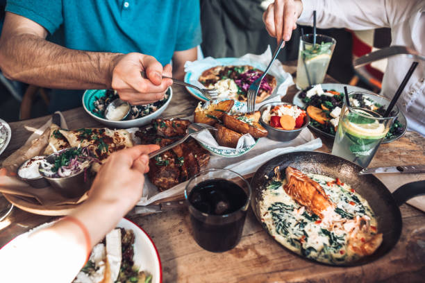 istock Enjoying lunch with friends 1205353592