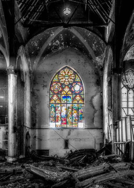 Beauty in the midst of destruction Inside an abandoned and vandalized inner church, a stained glass window somehow remains virtually unscathed. desecrate stock pictures, royalty-free photos & images