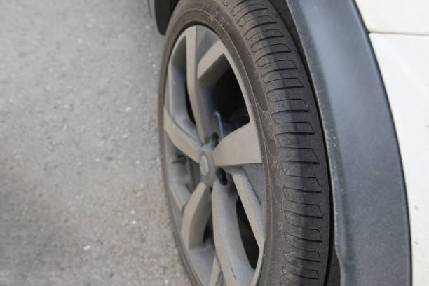 istock car rear wheel parts close up 1205354346