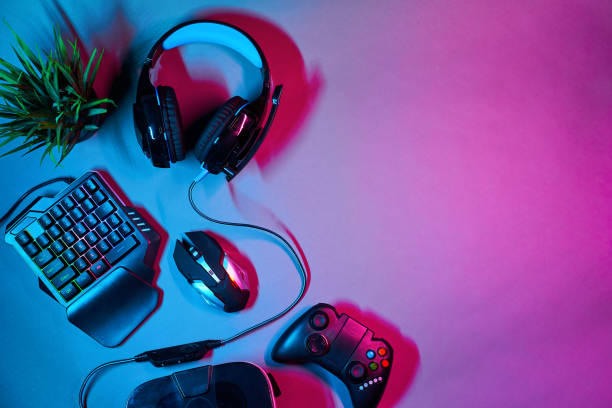 istock Keyboard, mouse, gamepad, virtual reality headset and headphones. 1205354773