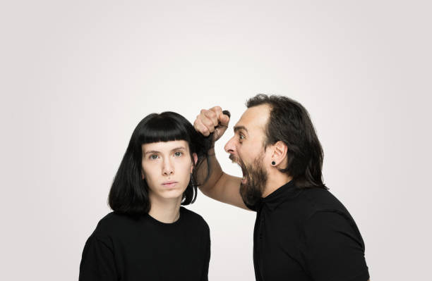 istock Young couple yelling at each other in studio 1205355526