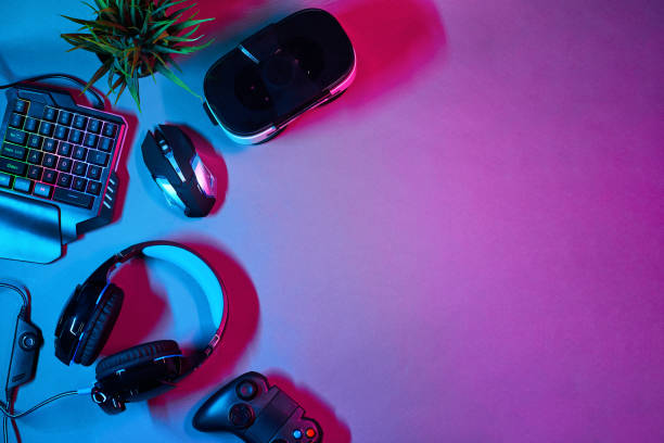 istock Keyboard, mouse, gamepad, virtual reality headset and headphones. 1205356226