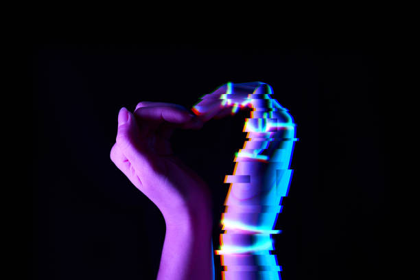 istock Heart shaped by human and robot hands. Isolated on black background. 1205356263