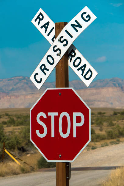 istock Rail Road Crossing and Stop signs 1205356273