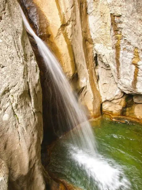 Photo of Alpine canyon waterfall