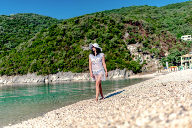 istock A women is walking by the water in nature 1205356949