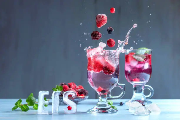 Wild berry cocktail with splashes of water