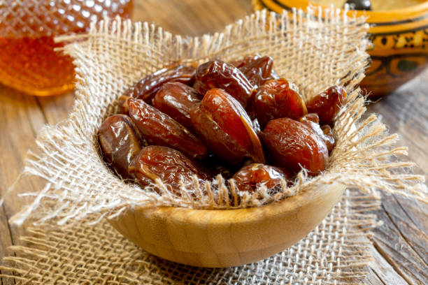istock dry sweet dates on wooden table 1205359201