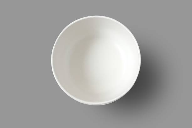 Empty bowl isolated on gray background with clipping path. Top view. stock photo