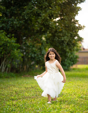 Beautiful girl running on grass