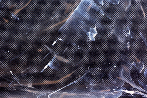 istock black textured grained background with splashes and stains 1205360318
