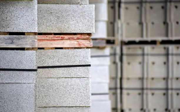 Close-up view of stacked cement bricks in a construction factory in Spain