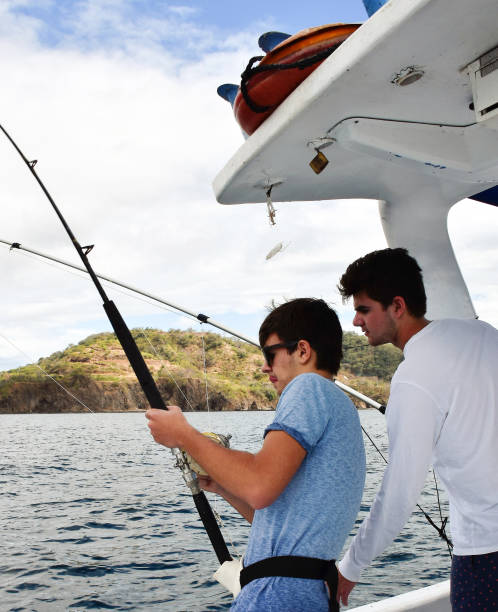 istock Young sports fishermen 1205363123