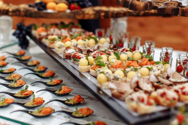 istock Different light snack on glass and wooden tray 1205363557