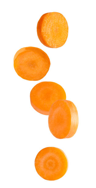 Isolated cut carrot fruits in the air stock photo