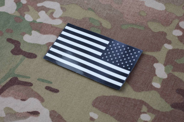 istock US ARMY flag patch on US ARMY camouflage uniform 1205368105