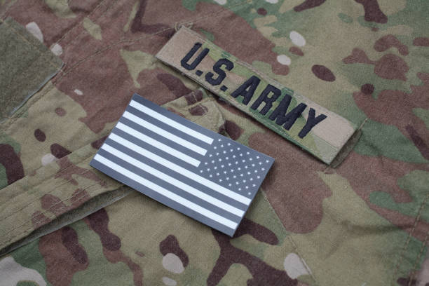 istock US flag patch with dog tag on US ARMY multicam camouflage uniform 1205368217