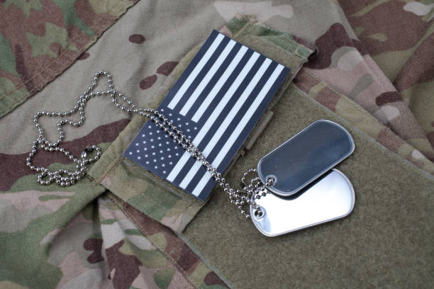 istock US flag patch with dog tag on US ARMY multicam camouflage uniform 1205368262