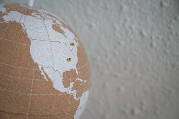 istock Cork globe with USA and Canada pushpins 1205368283