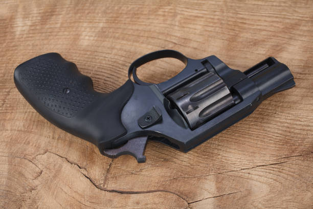 istock Revolver on the wooden table 1205369288