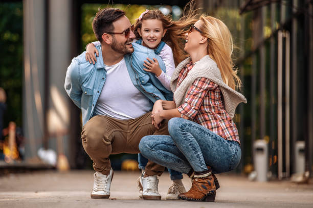 istock Happy young family of three smiling while spending time together 1205373688