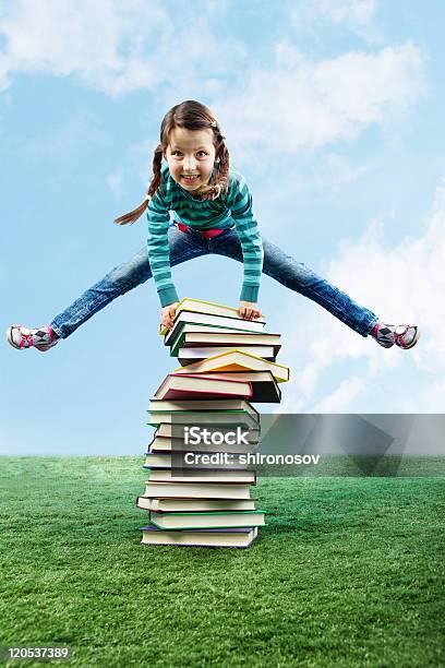Leaping Through Stack Stock Photo - Download Image Now - Book, Outdoors, Stack