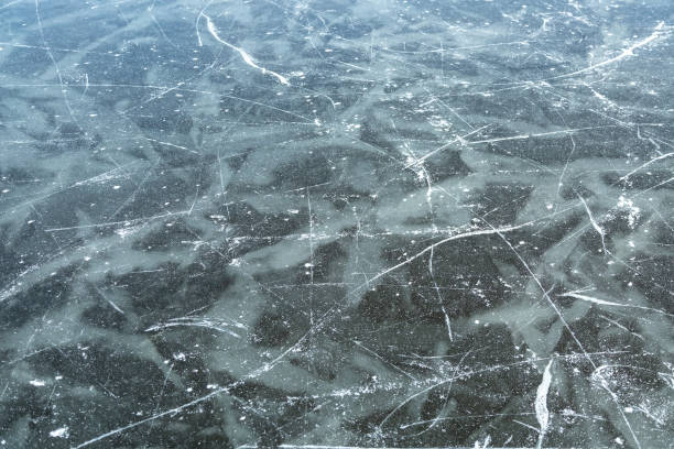 istock Ice Skating Tracks on Frozen Lake in Winter 1205375232