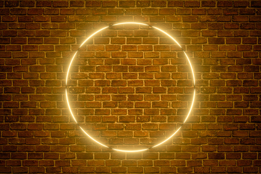 3d rendering of empty frame with ultraviolet yellow glowing neon light on brick wall background. Abstract background.