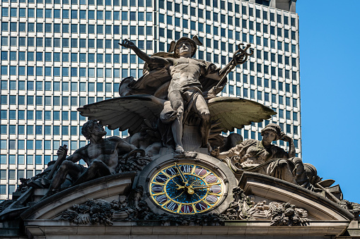 New York, USA - June 23, 2019: Grand Central Station in New York. The iconic beaux arts statue of the Greek God Mercury that adorns the south facade of Grand Central Terminal on 42nd Street.