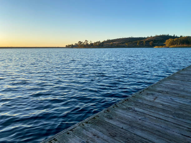 istock little wood pier at Miramar lake before sunset twilight 1205376716