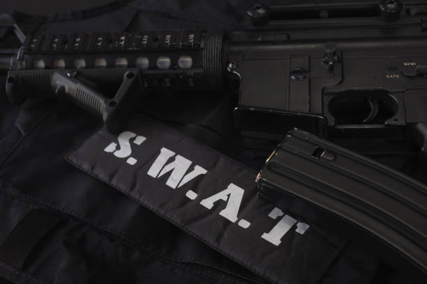 istock Special weapons and tactics team equipment on black background 1205376748