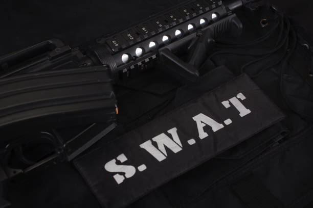 istock Special weapons and tactics team equipment on black background 1205376756