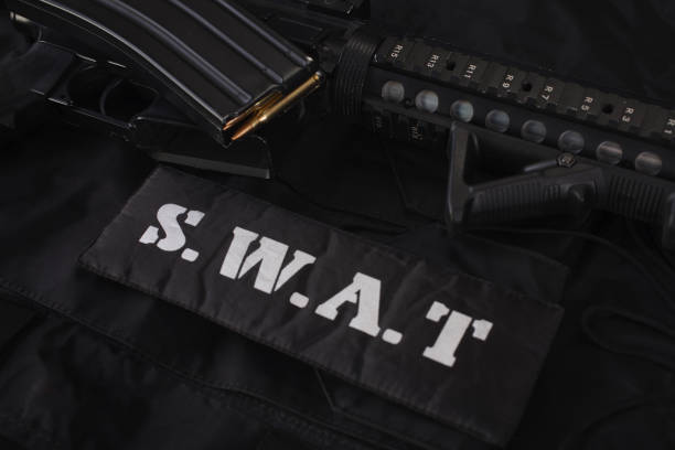istock Special weapons and tactics team equipment on black background 1205376805
