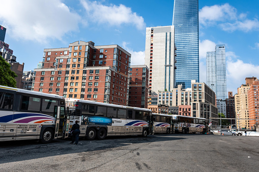 New York, USA - June 6, 2019: public transportation system buses parked in a lot in the  Manhattan