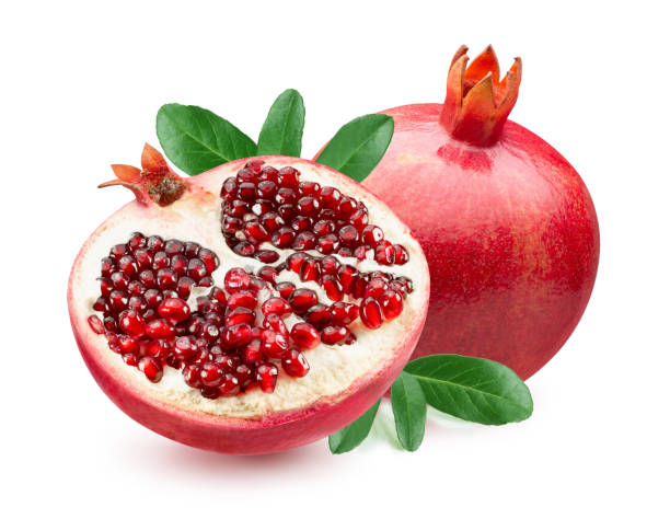 istock pomegranate with half of pomegranate and leaves isolated on a white background 1205379151