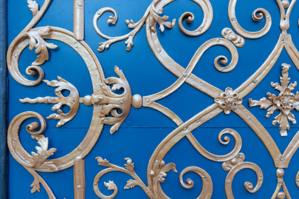 istock gold ornaments on an old blue door 1205380546