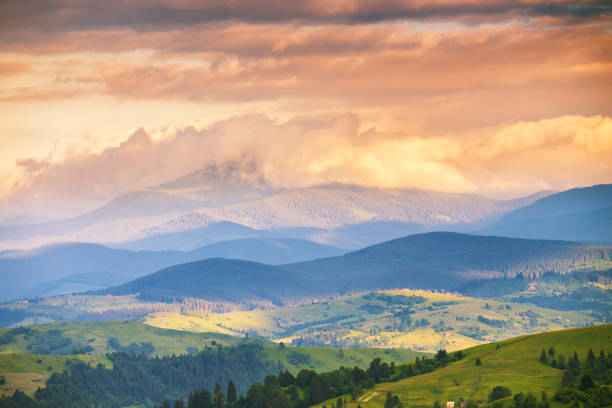 istock panoramic summer mountains landscape, awesome evening sunset view on meadow 1205385816