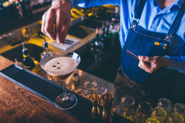 Barista making cocktail Barista making espresso martini martini photos stock pictures, royalty-free photos & images