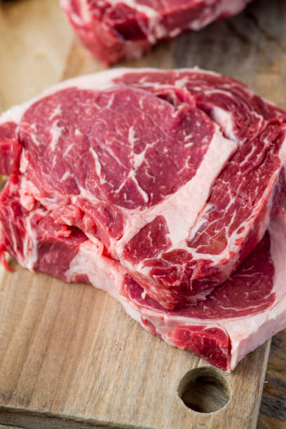istock Steak filet migon. Grade A, grass fed angus beef. Traditional classic New York steakhouse menu favorite. T-bone steak whole raw and uncooked. 1205397677