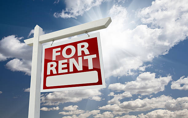 istock Right Facing For Rent Real Estate Sign Over Sunny Sky 120539772