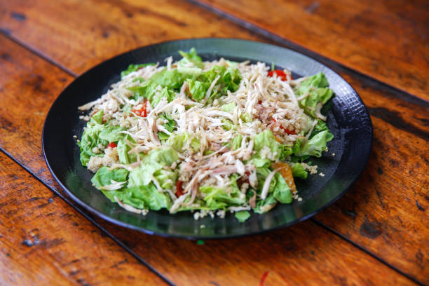 Close up shot of shredded chicken salad for lunch meal, at home