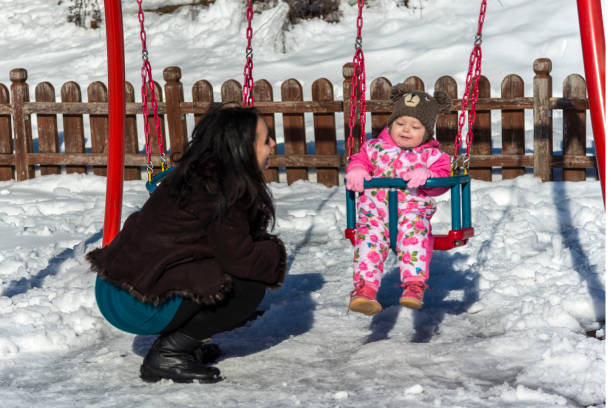 istock Happy children playing in the snow 1205401703