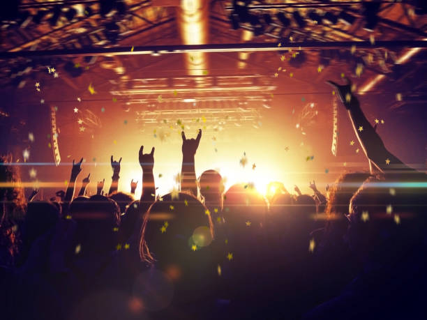 istock Concert hall with people silhouettes 1205402739