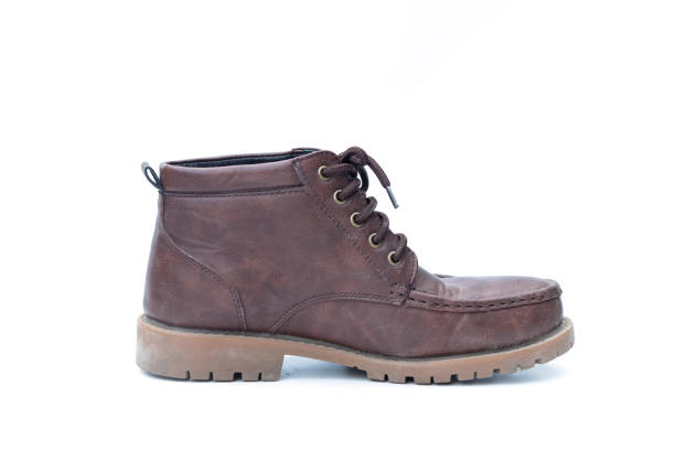 istock Brown old shoes on a white background 1205402910