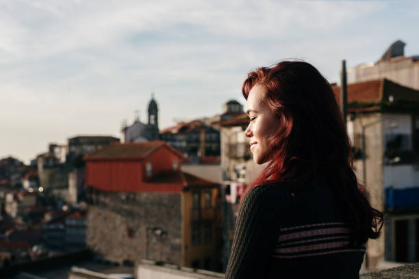 istock Young woman with dyed red hair 1205402977